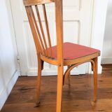 Baumann chair stamped in red skai