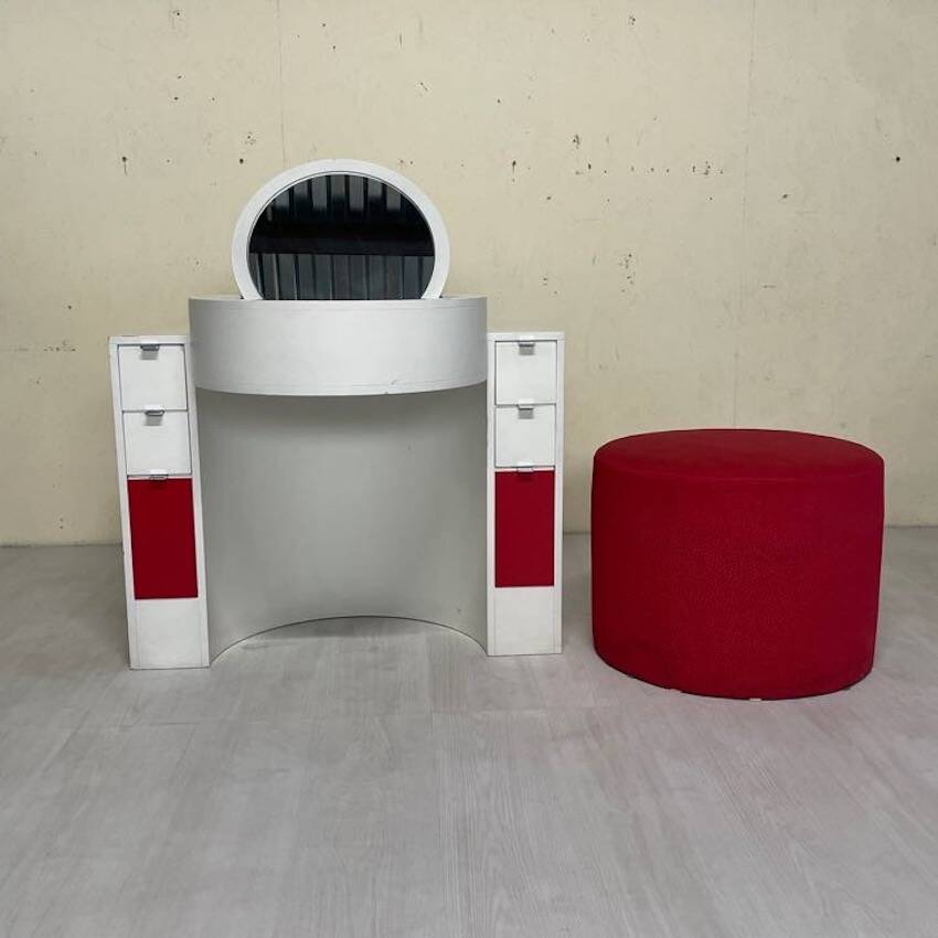 Bathroom toilet with a 70s pouf.