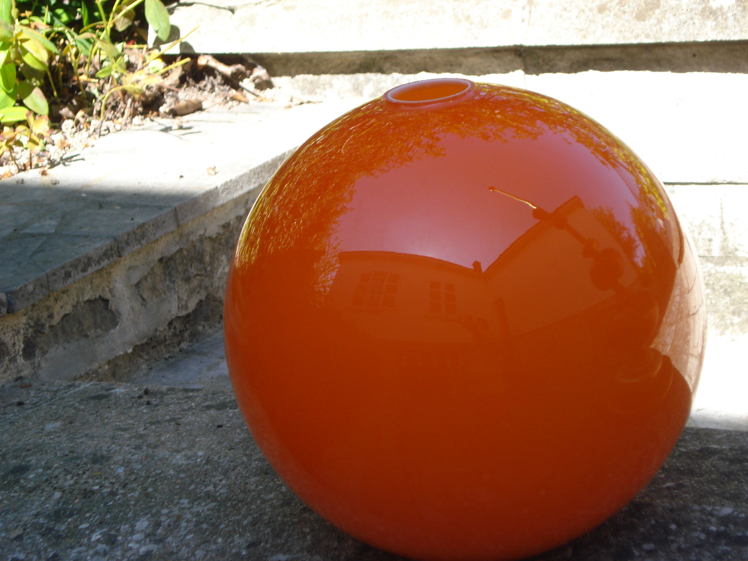 Orange glass globe, 1970