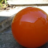 Orange glass globe, 1970