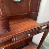 Antique wooden coat rack with mirror and shelf.