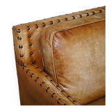 Three-seater leather canapé in Edwardian style with studs.