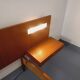 Double bed in vintage Scandinavian style from the 1960s with bedside tables.