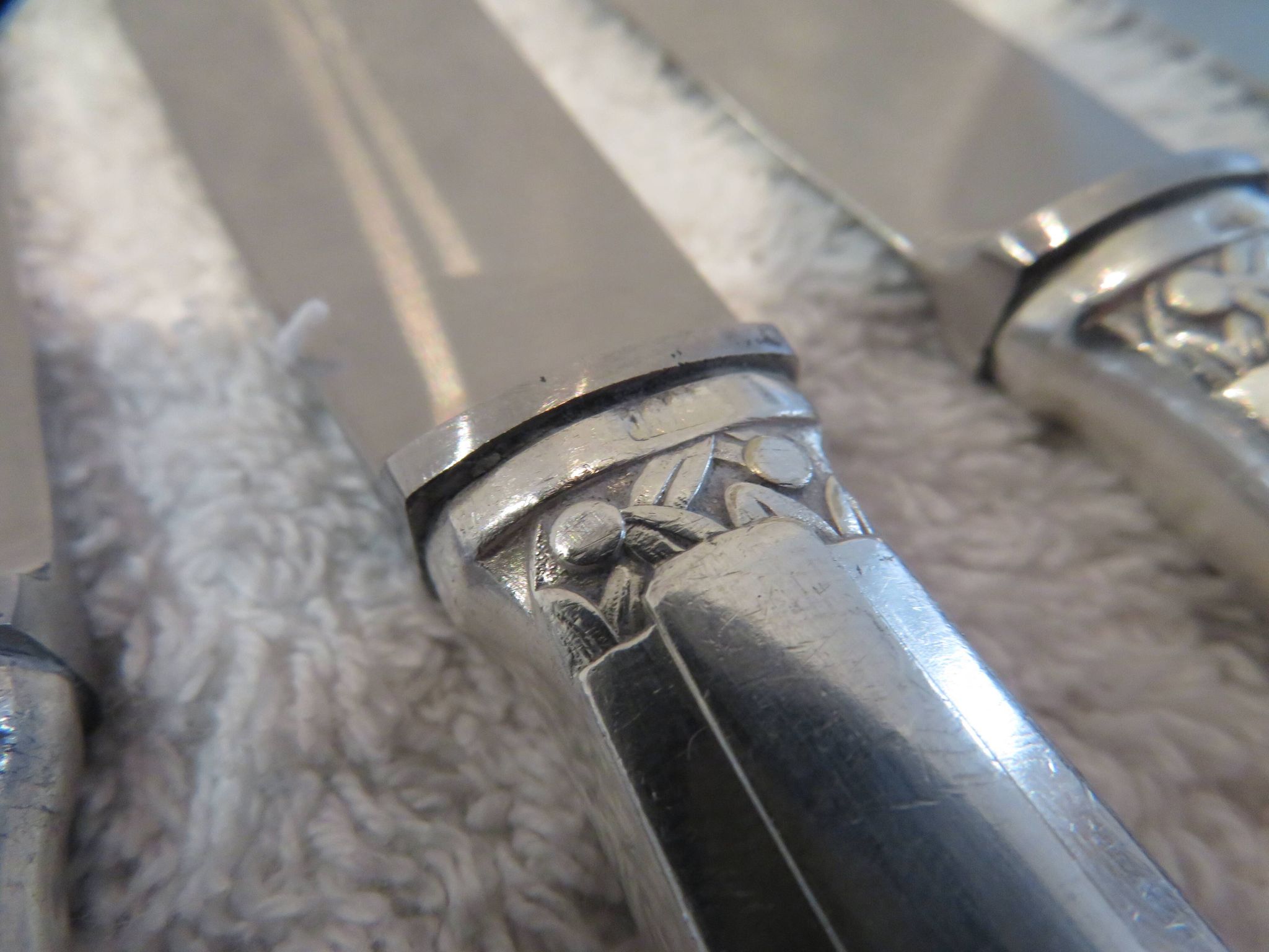 12 silver plated table knives by Argit goldsmith? Art Deco floral bands