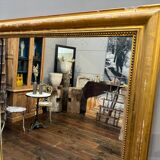 Old gilded fireplace mirror
