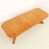 Large extendable Danish dining table in solid pine, 1970s.