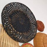 Wall composition of wicker baskets and trays.