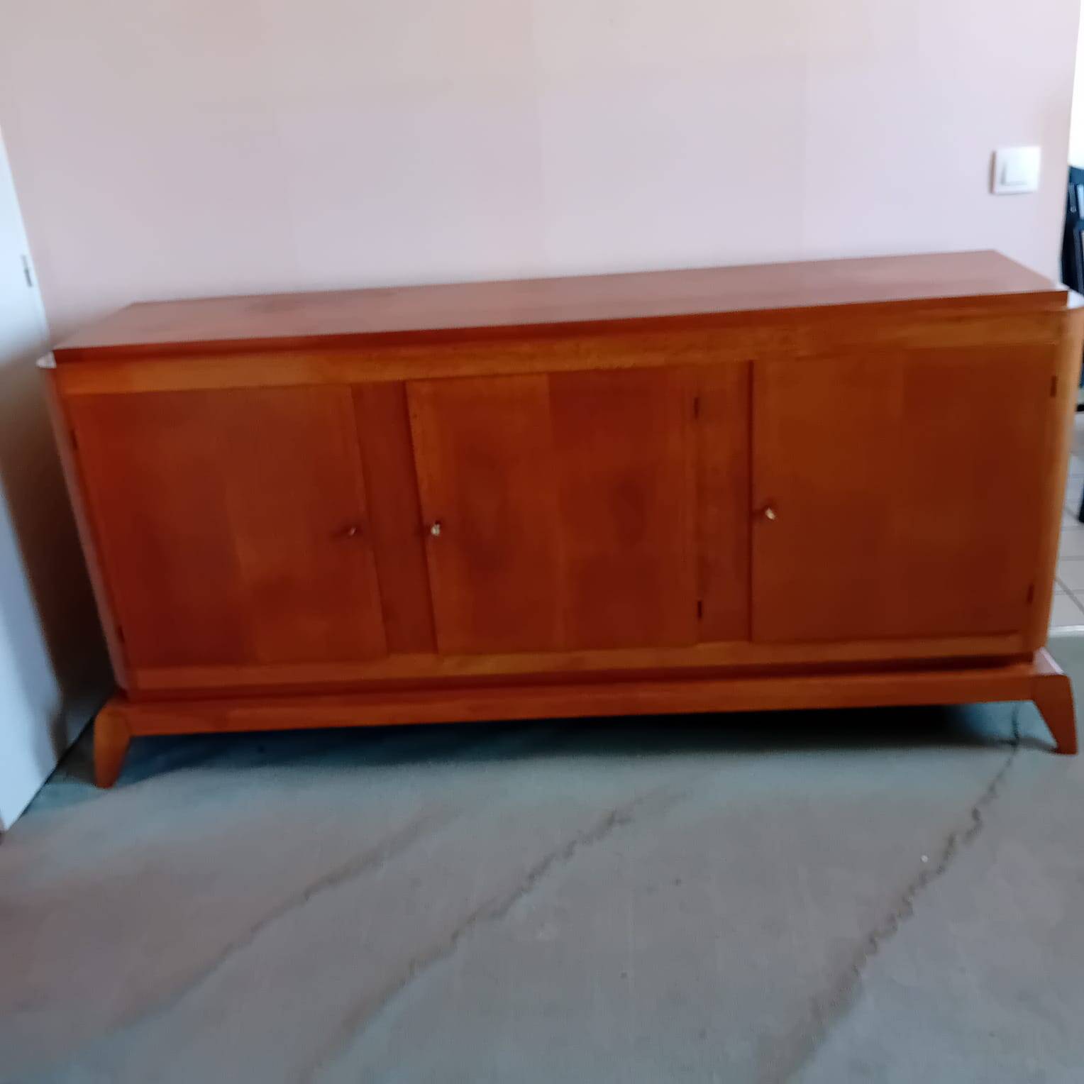 Large vintage sideboard with compass legs.