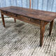 Antique chestnut farmhouse table with 3 drawers on the front.