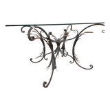 Glass top table with iron base in the style of wheat ears. Attributed to Robert Goossens.