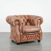 Chesterfield armchair in English style made of cowhide leather