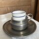 Pewter and porcelain cup and saucer