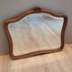 Elongated wooden mirror
