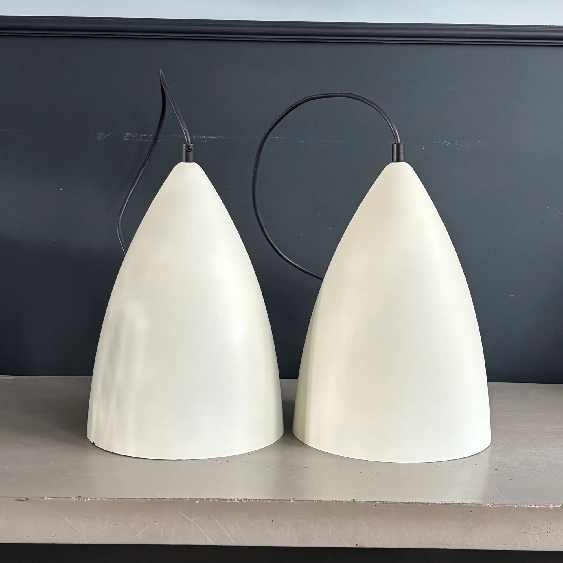Pair of lacquered metal pendant lights with rose.