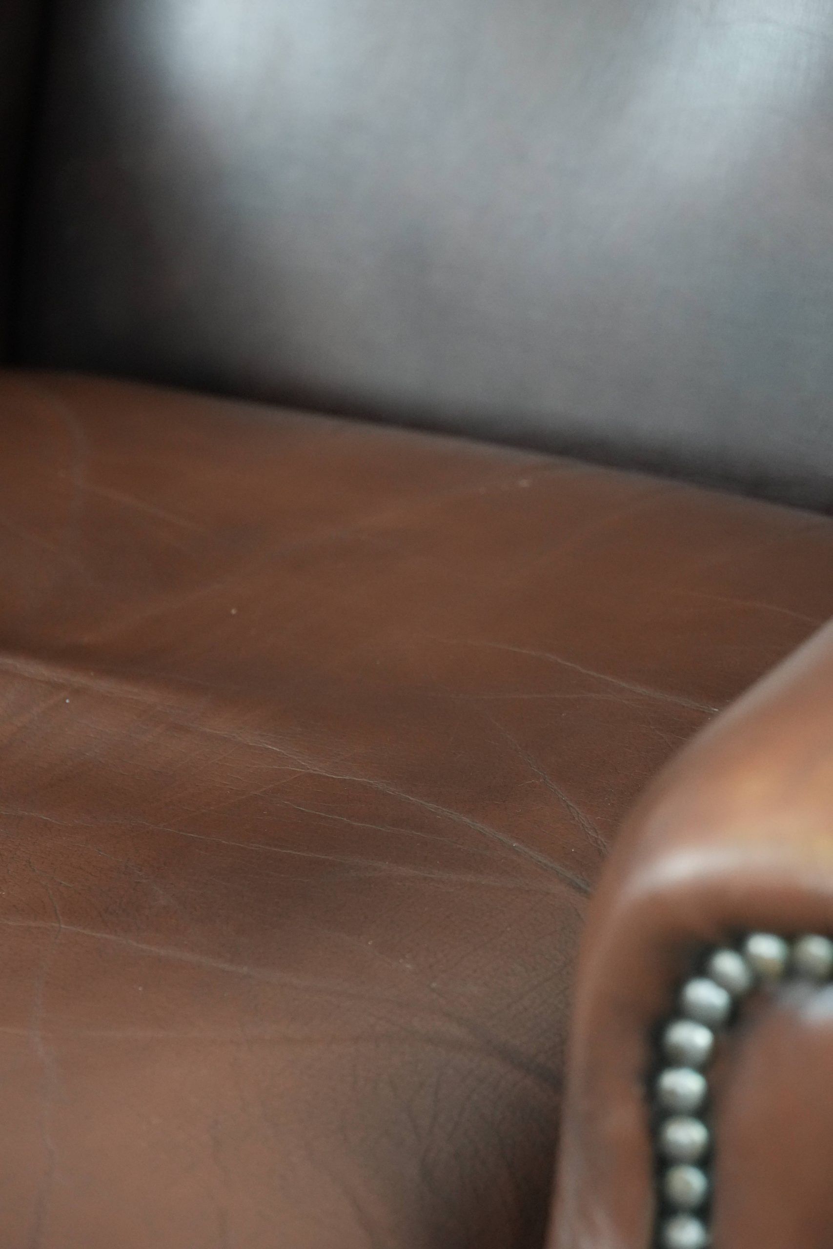 Brown smooth cow leather Chesterfield wingback armchair in English style