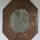 Antique bevelled artisanal mirror in repoussé copper - 54x45cm