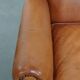Fauteuil à oreilles en cuir de vache