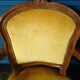 Velvet cabriolet armchair with decorative copper studs.