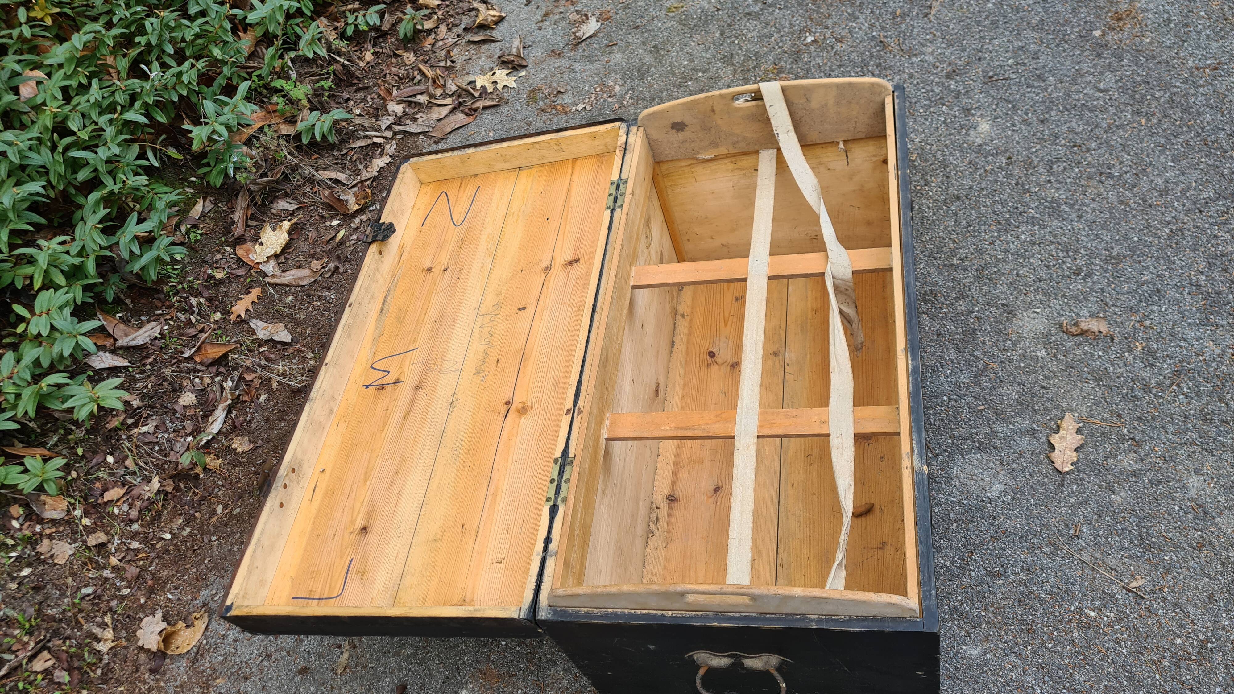 Old wooden trunk with interior compartments