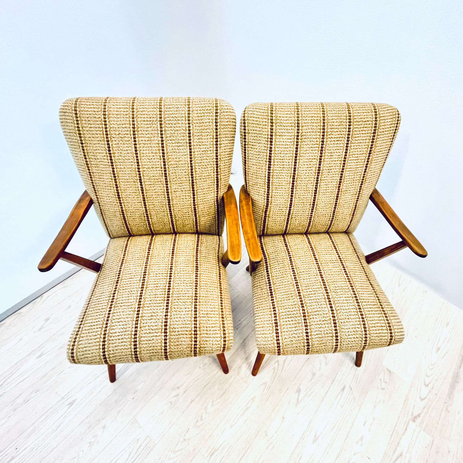 A pair vintage cocktail chairs with stripes and metal screws