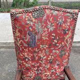 Henri II armchair in solid wood and floral burgundy fabric, 19th century.
