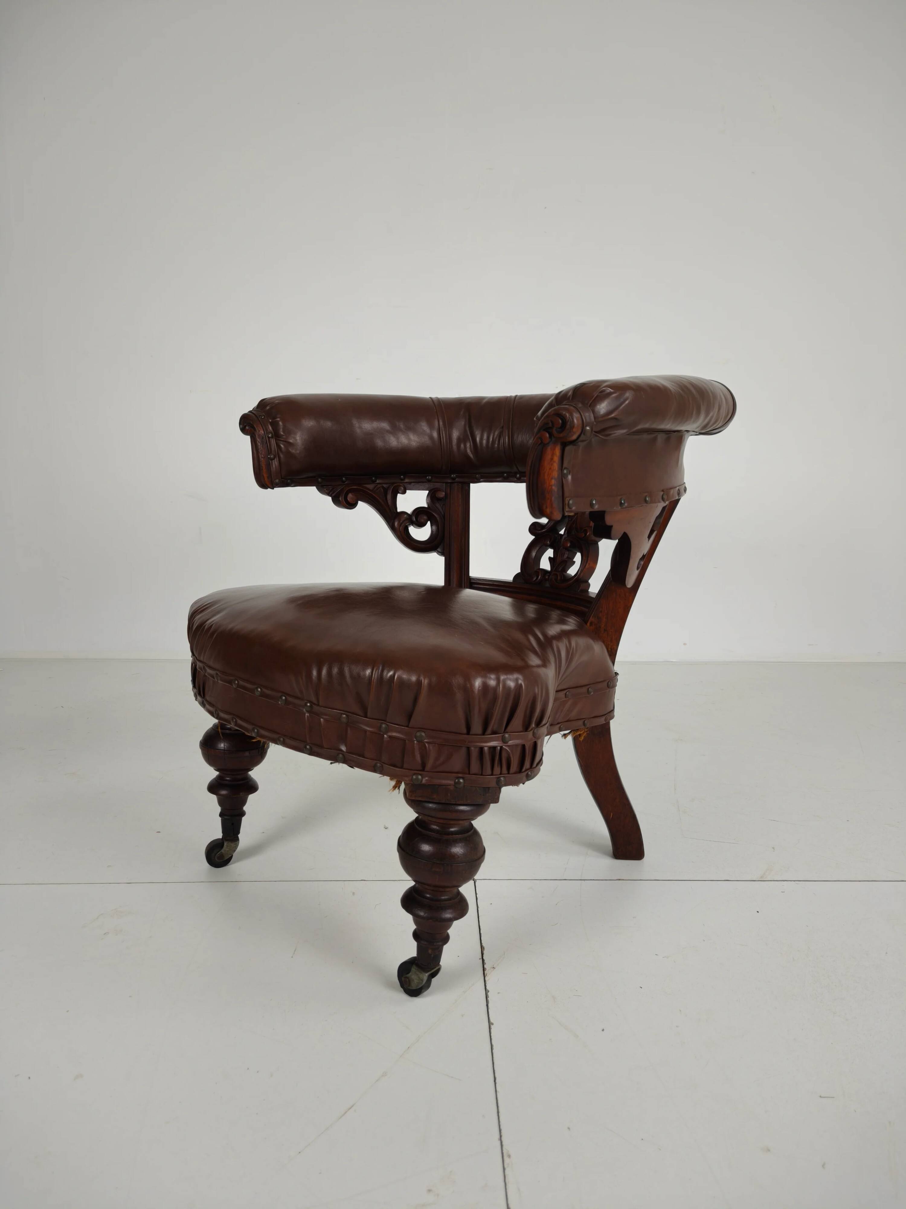 Antique leather armchair by Robson & Son – carved wood & castors, Newcastle