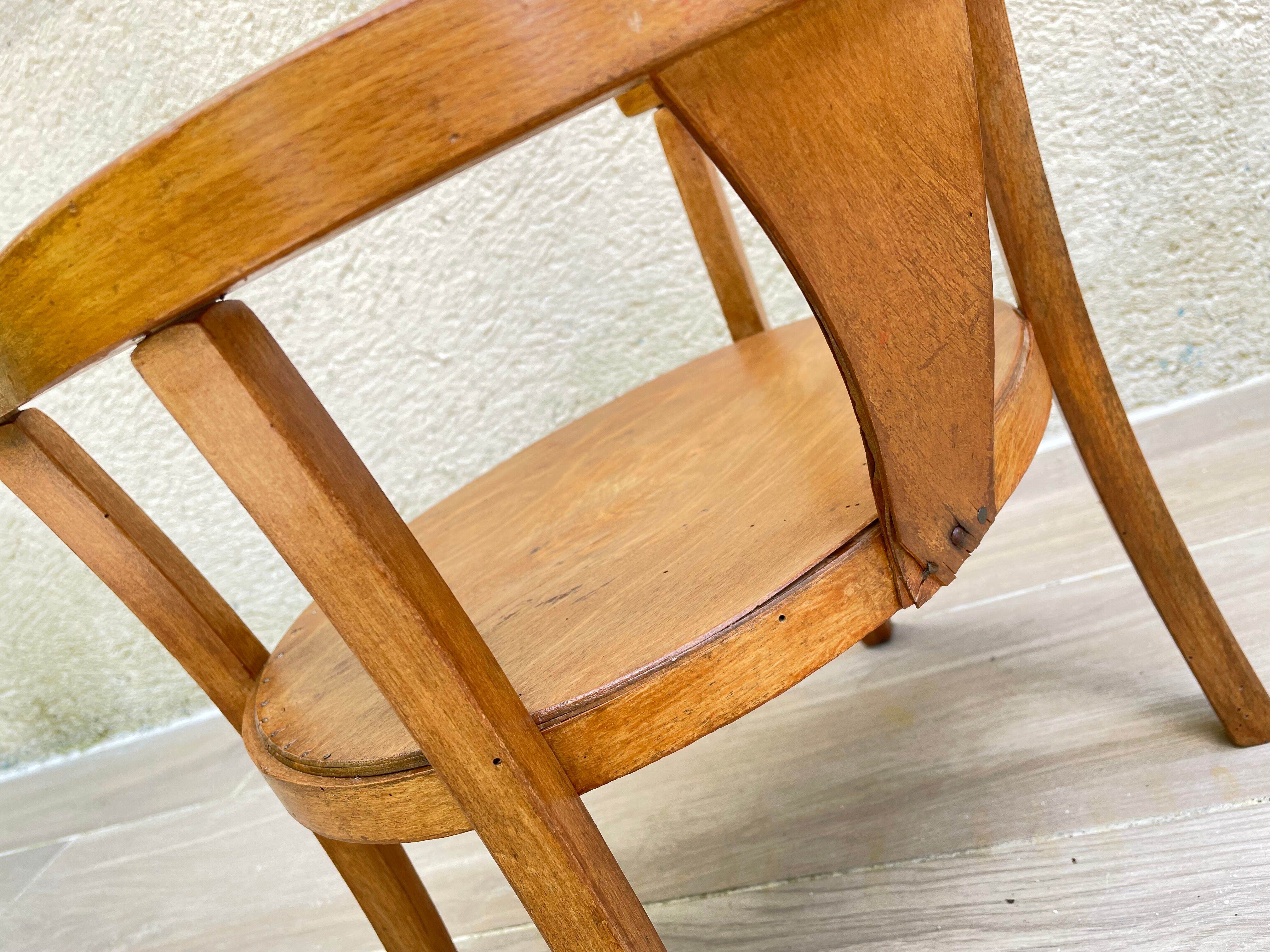 Old armchair for children in wood