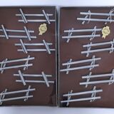 Twelve 70s design metal knife holders
