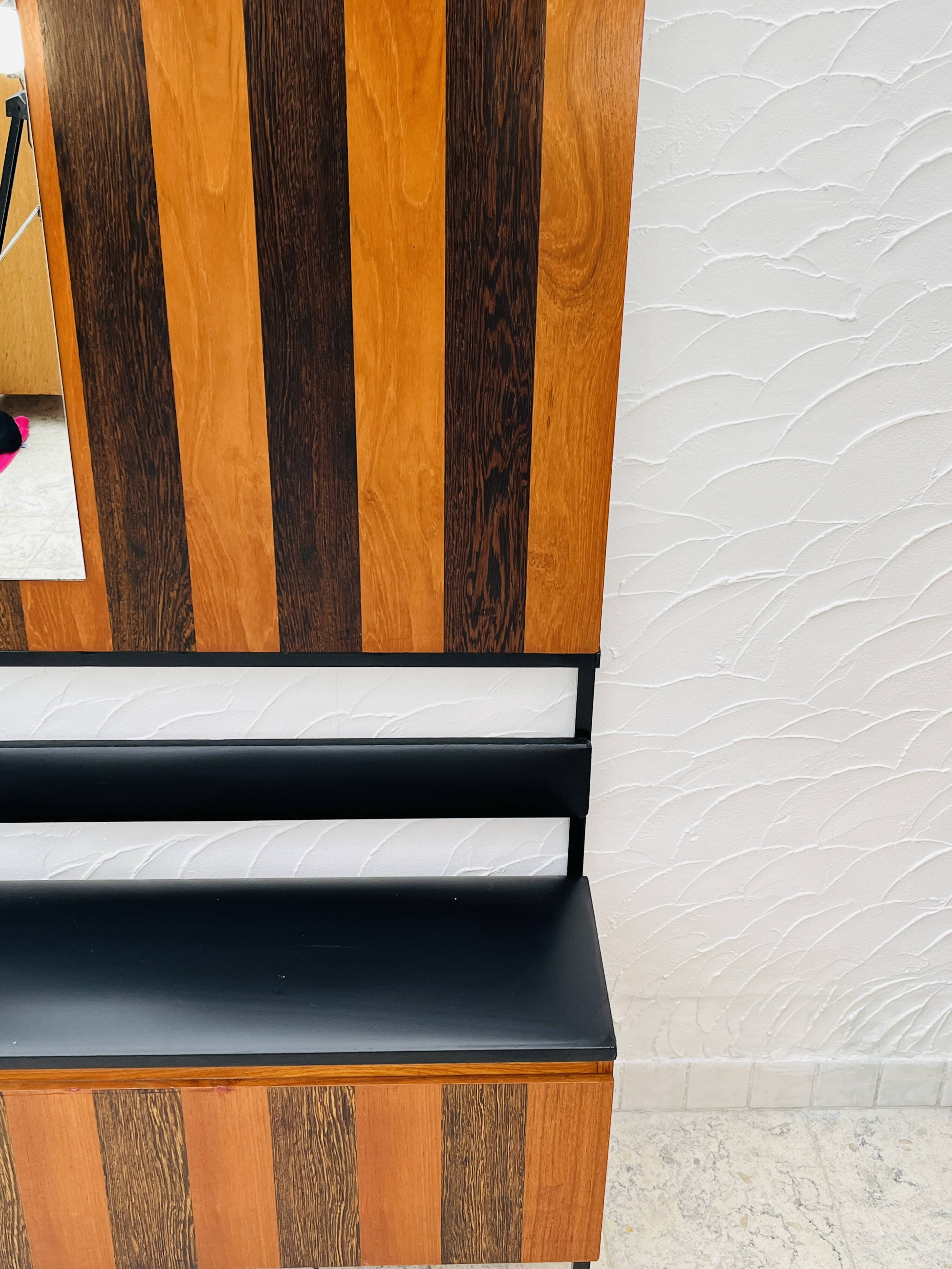 Vintage wall coat rack with storage bench from the 1970s.