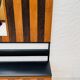Vintage wall coat rack with storage bench from the 1970s.