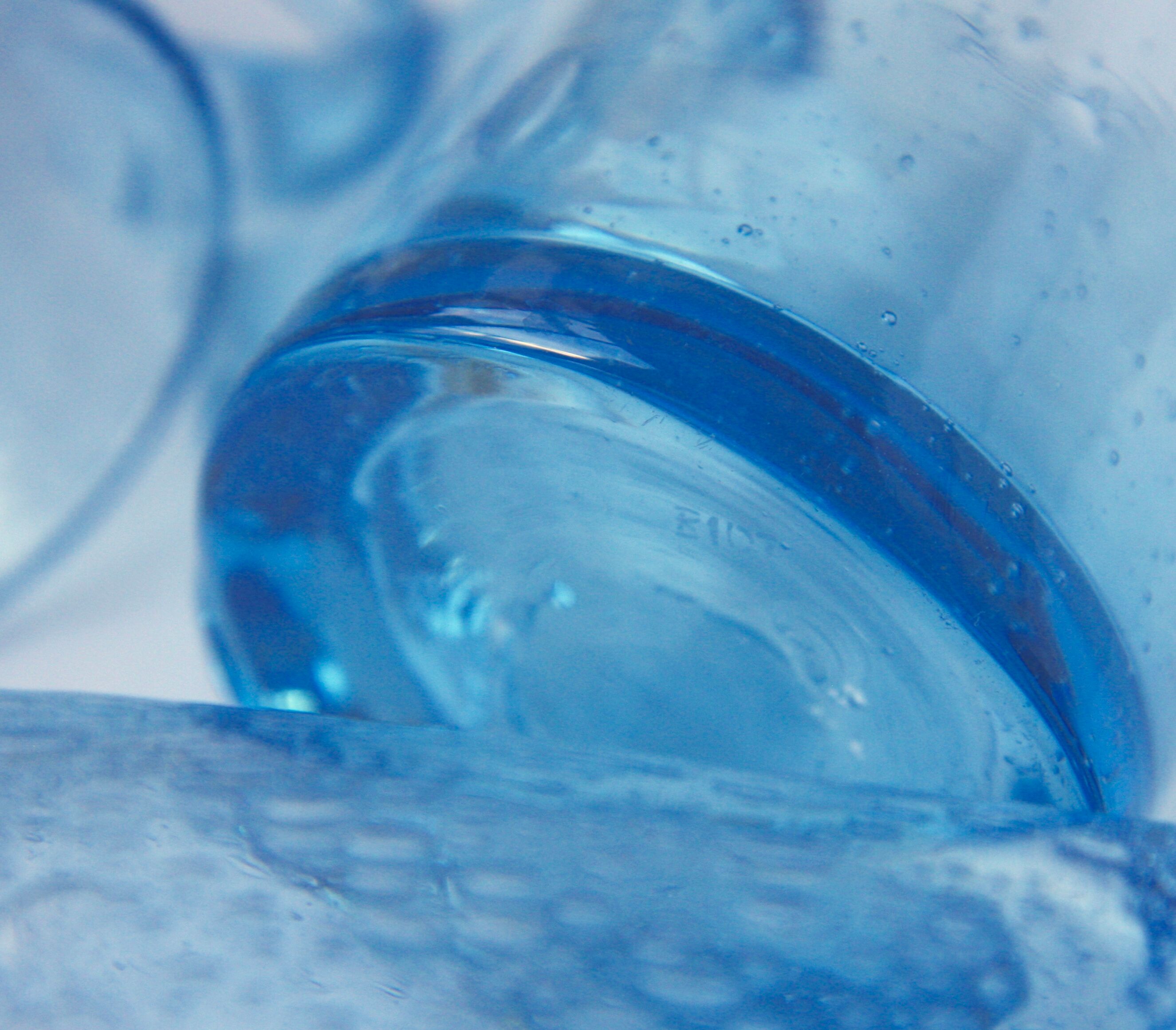 Four Biot glass mugs blue bubbled glass
