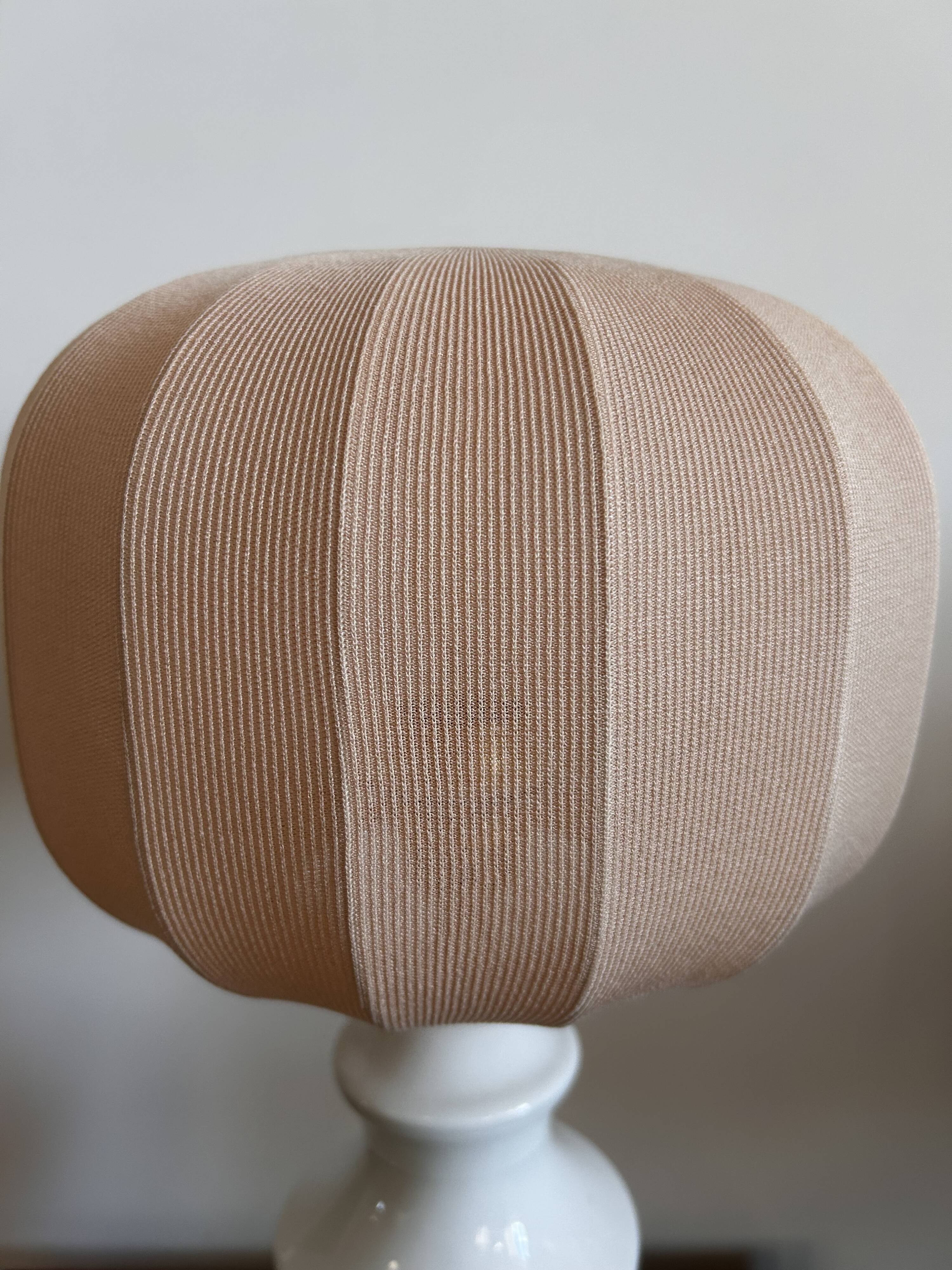 White ceramic table lamp with pastel shade