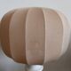 White ceramic table lamp with pastel shade