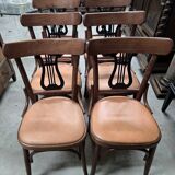 Set of 6 vintage curved wooden chairs, adorned with an elegant black lyre-shaped backrest.