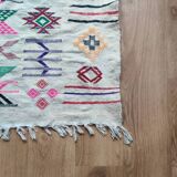 White Moroccan rug with Berber patterns.