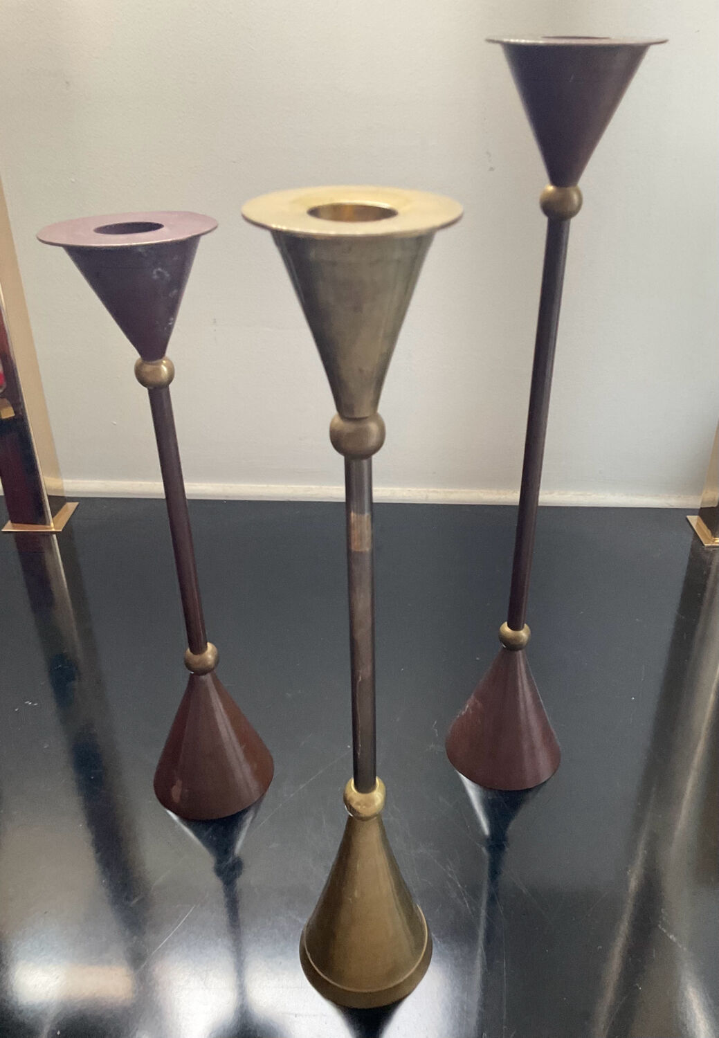 Trio of vintage brass and copper candle holders