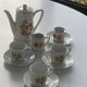 Porcelain dinette for dolls consisting of a coffee maker, cups and saucers, vintage