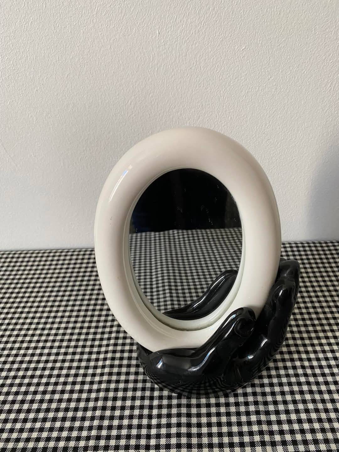 Main miroir