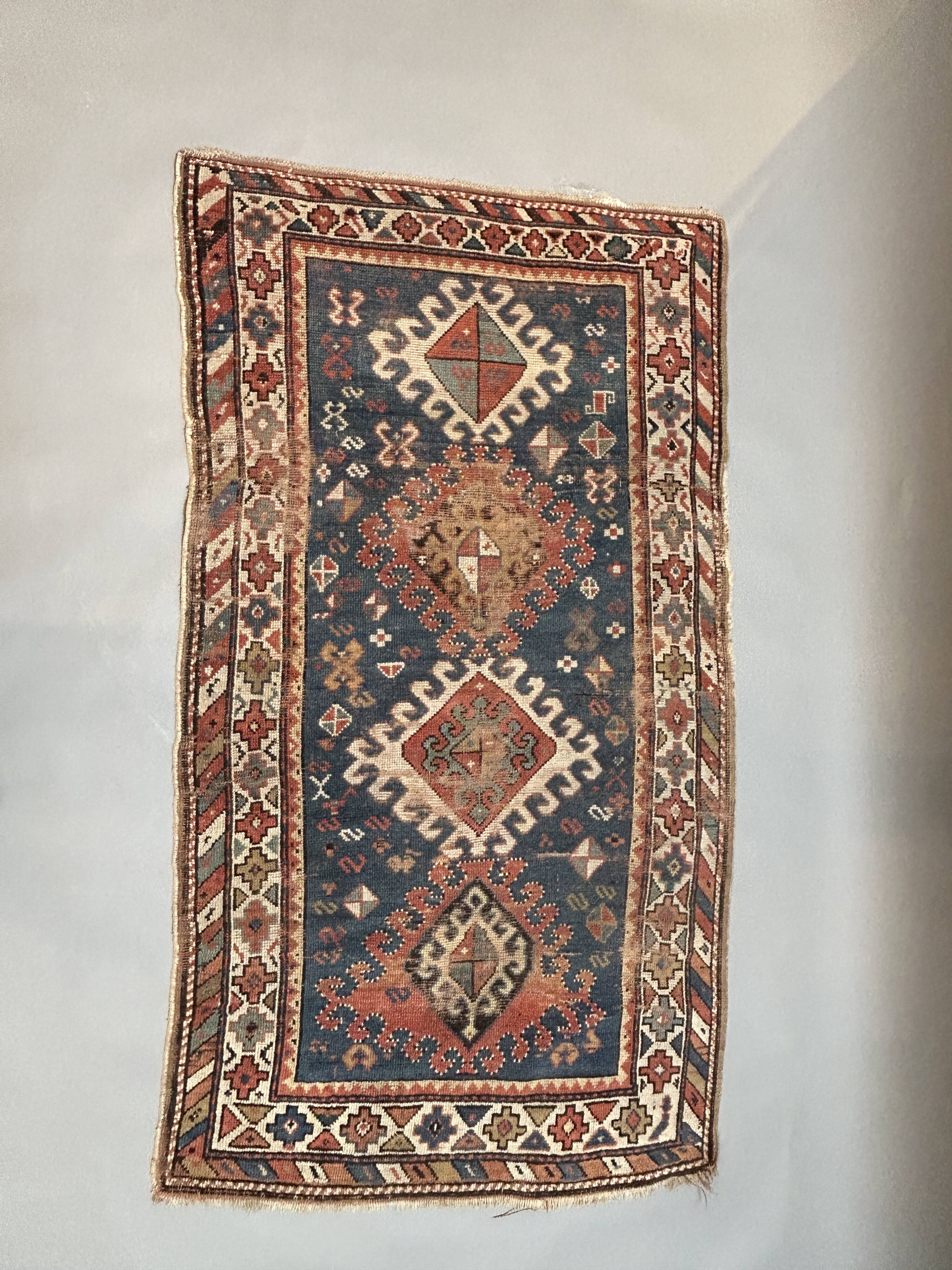 Antique kazak rug blue ground