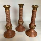 Trio of large brown and gold candlesticks