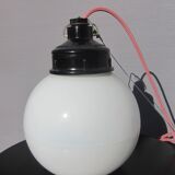 Trio of opal glass and bakelite globe pendant lights