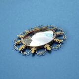 Circular gold metal mirror with floral decoration – 1960s