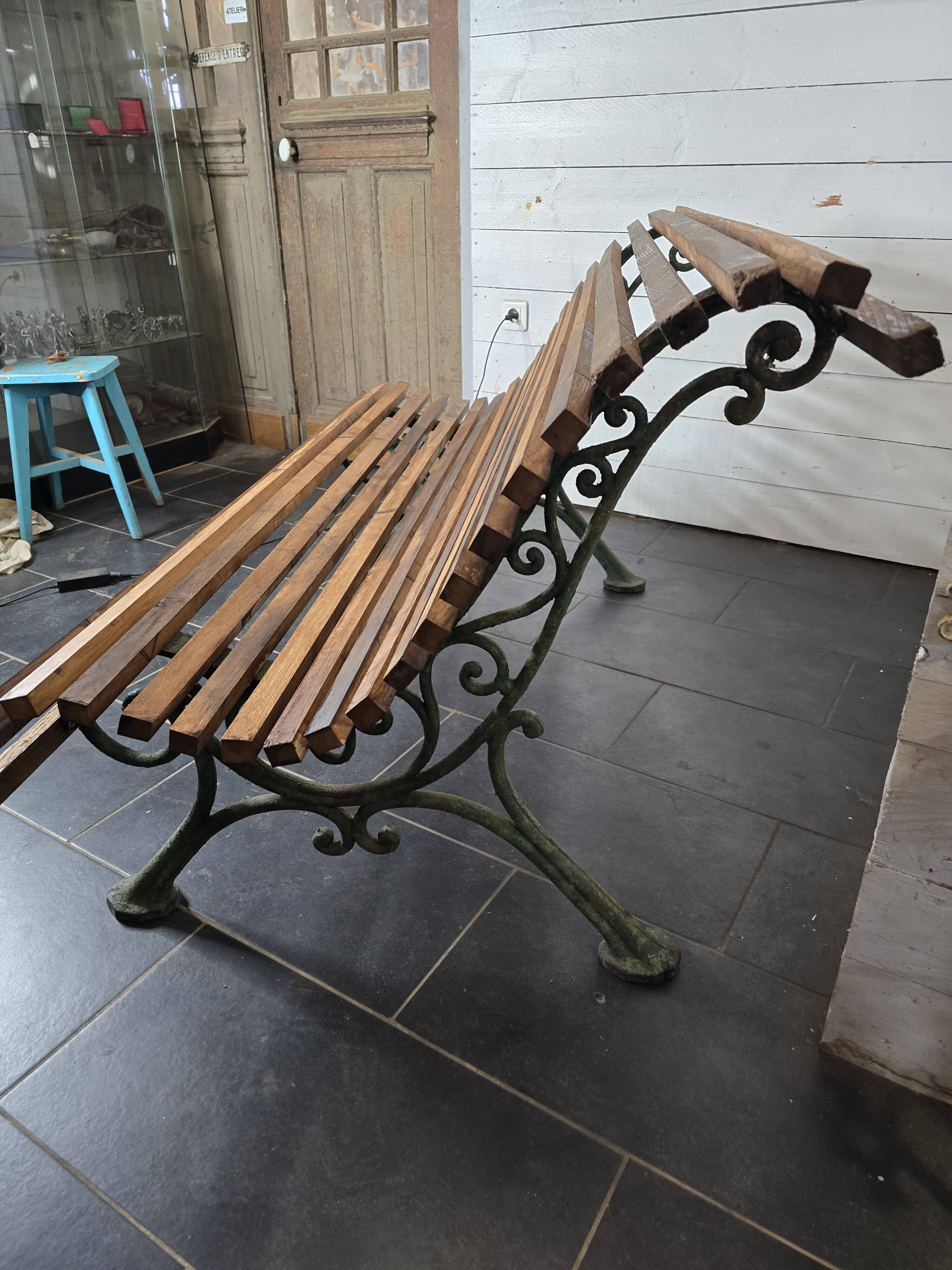 Old cast iron garden bench with oak slats