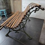 Old cast iron garden bench with oak slats