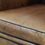 Large and comfortable sheepskin leather wingback chair with black piping