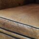 Large and comfortable sheepskin leather wingback chair with black piping