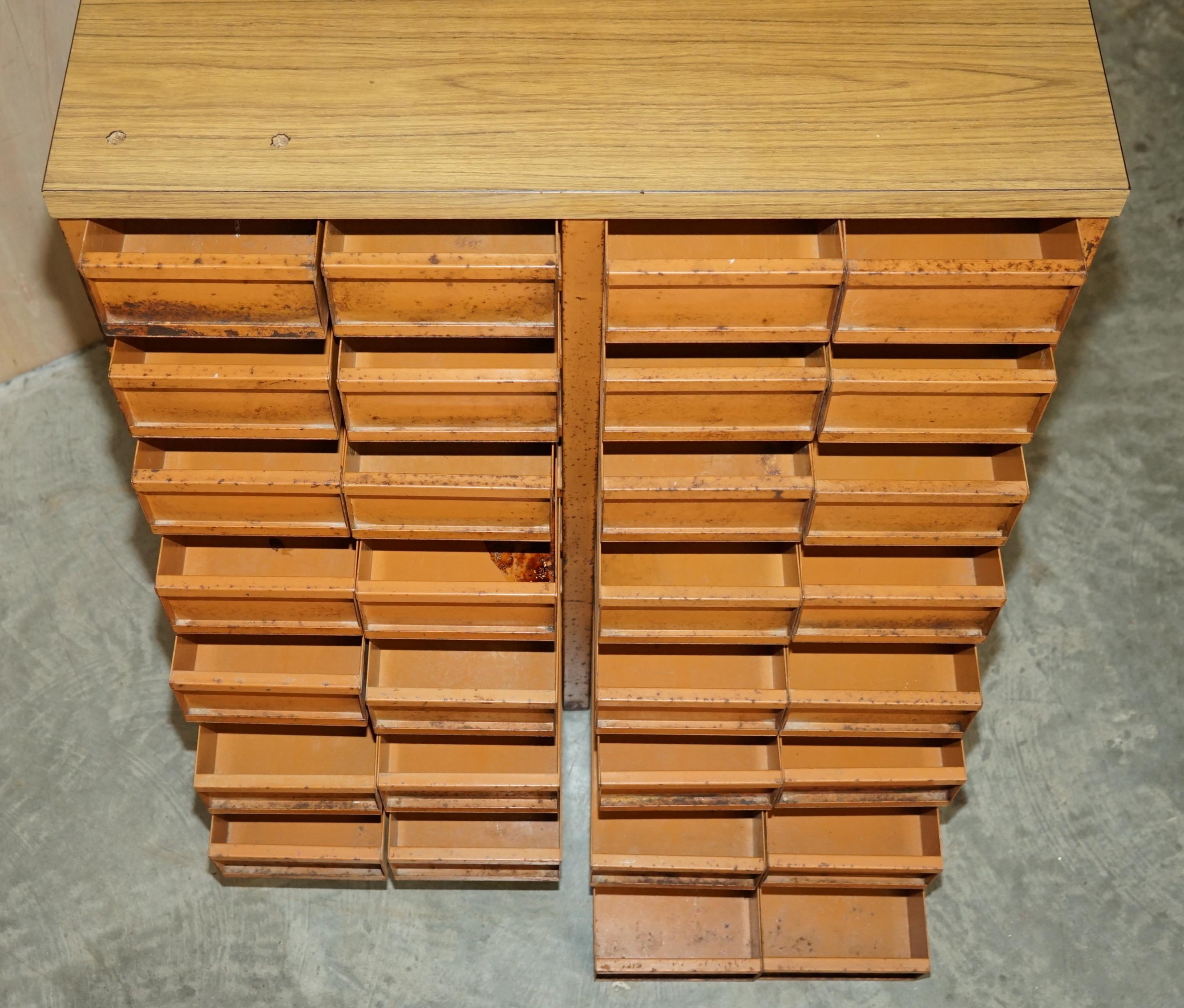 Industrial metal chest of drawers with 30 drawers.