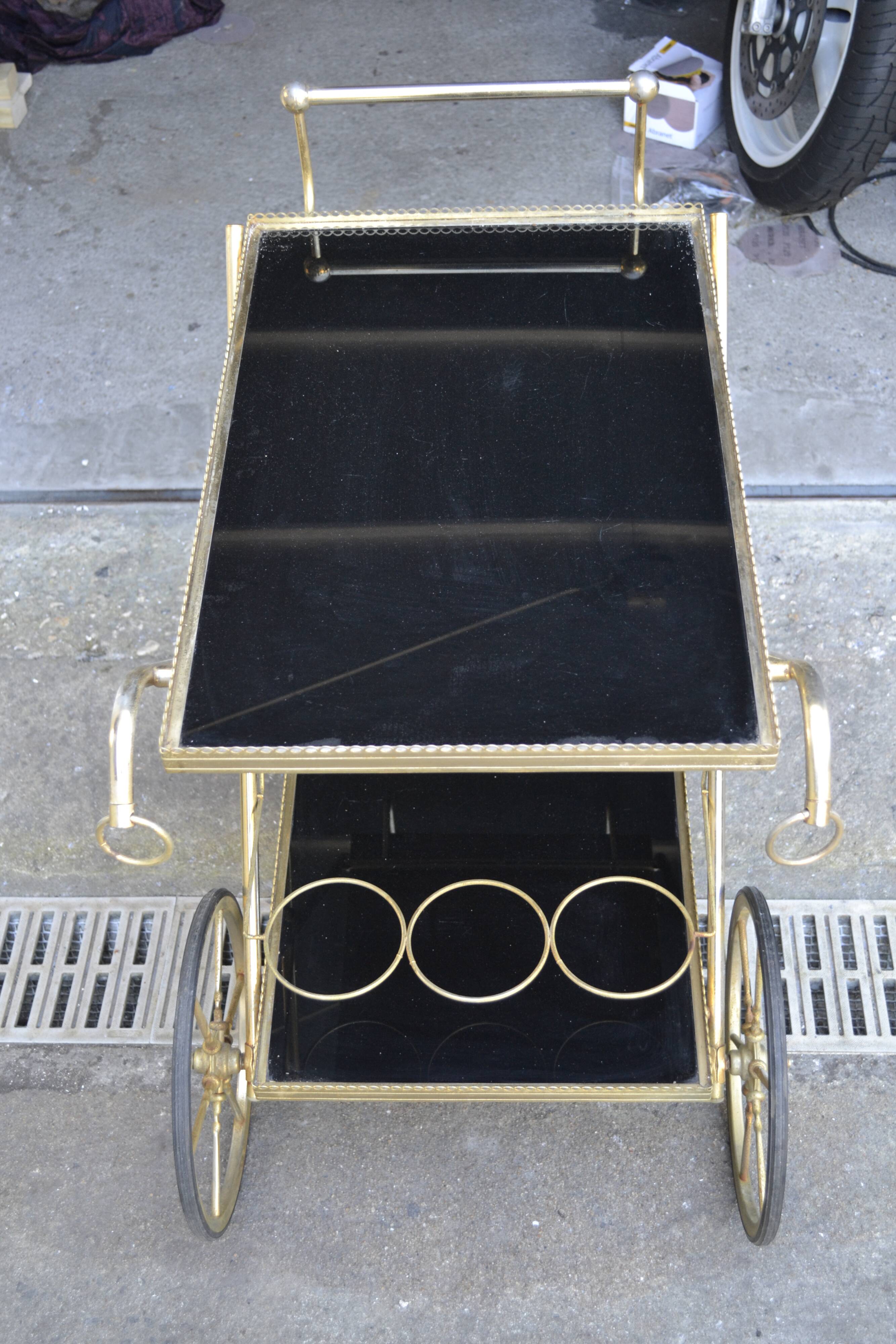 Rolling cart in brass and smoked glass