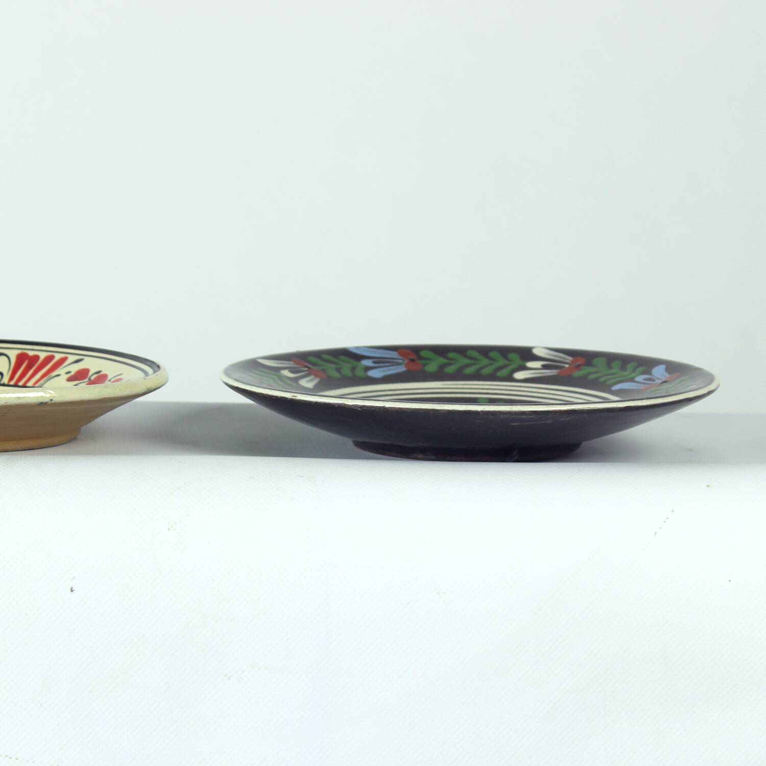 Set of three vintage folk art ceramic wall plates, Czechoslovakia and Romania.