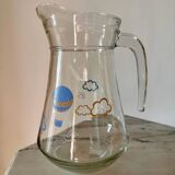 Glass pitcher with cloud decoration